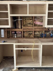 What is behind Kitchen Cabinets